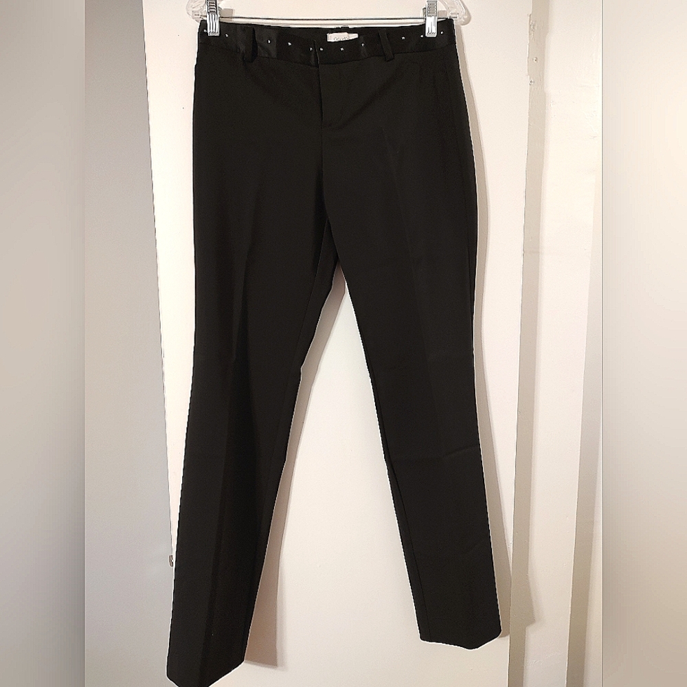 Chic black fitted pants with a decorative waist.